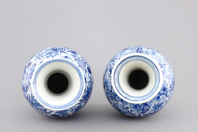 A pair of Chinese porcelain blue and white flower scroll vases, Kangxi, ca. 1700