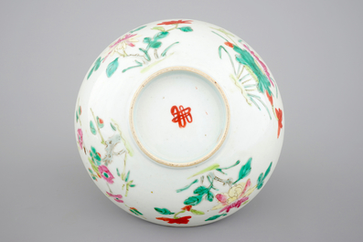 A blue and white Chinese porcelain plate with flowers and a famille rose bowl, 18th C.