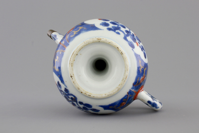 A set of three fine Chinese famille rose cups and two saucers, Yongzheng, and a Chinese Imari teapot, 18th C.