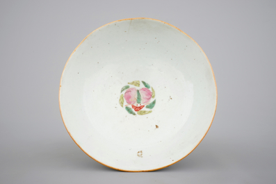 A blue and white Chinese porcelain plate with flowers and a famille rose bowl, 18th C.