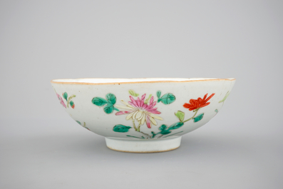 A blue and white Chinese porcelain plate with flowers and a famille rose bowl, 18th C.