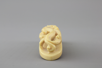A rare Chinese carved ivory belt hook, 19th C.