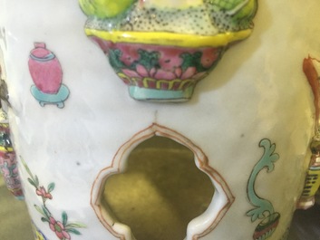 A pair of Chinese famille rose porcelain relief-moulded hat stands, 19th C.
