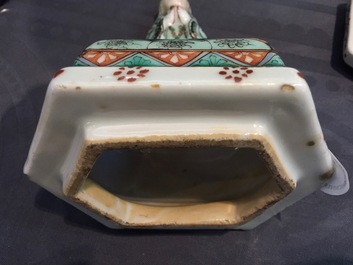 A pair of rare hexagonal Chinese famille jaune porcelain vases with figural covers, 19th C.