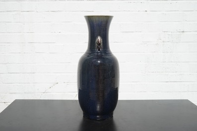 A tall Chinese porcelain flambe glaze vase with elephant handles, 19/20th C.