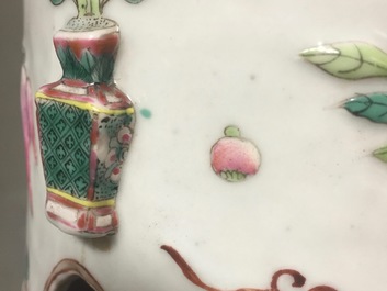 A pair of Chinese famille rose porcelain relief-moulded hat stands, 19th C.