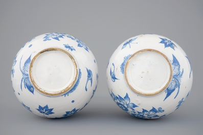 A pair of Dutch Delft blue and white bottle-shaped vases, 17th C.