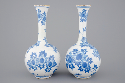 A pair of Dutch Delft blue and white bottle-shaped vases, 17th C.