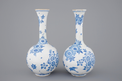 A pair of Dutch Delft blue and white bottle-shaped vases, 17th C.