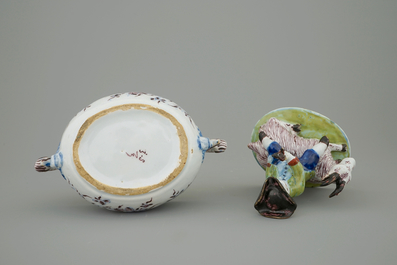 A Dutch Delft polychrome butter tub with a buckrider, 18th C.