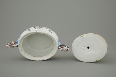A Dutch Delft polychrome butter tub with a buckrider, 18th C.