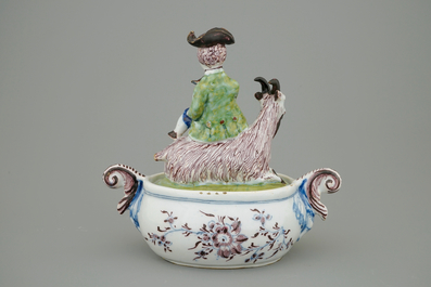 A Dutch Delft polychrome butter tub with a buckrider, 18th C.