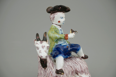 A Dutch Delft polychrome butter tub with a buckrider, 18th C.