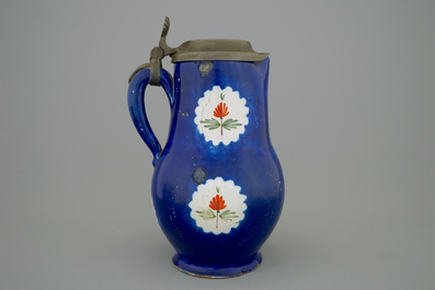 A Brussels faience jug with a drinking man, late 18th C.