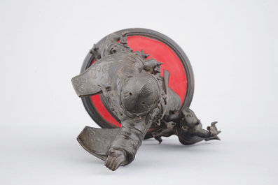 A Chinese mythological bronze group, 19/20th C.
