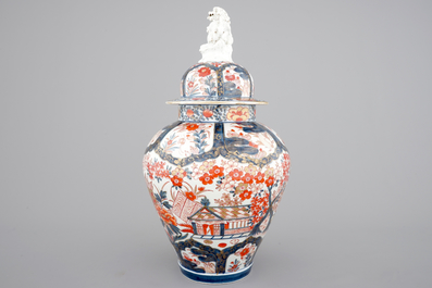 A tall Japanese Imari vase, 17/18th C. and two Chinese famille rose plates, 19th C.