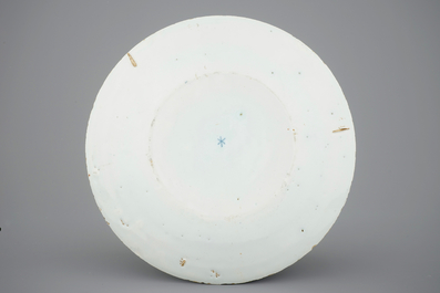 A fine Dutch Delft blue and white plate with a pastoral scene, 18th C.