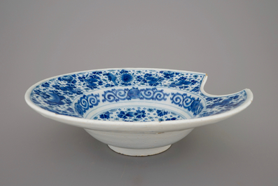 A blue and white Dutch Delft shaving bowl, early 18th C.