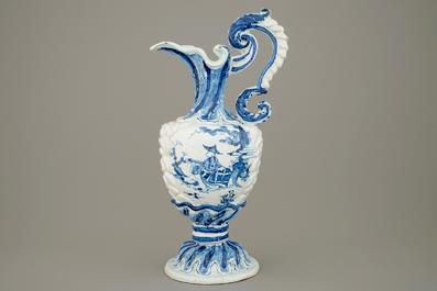 A large French faience blue and white relief-decorated jug, 18th C.