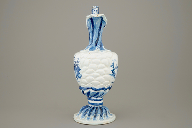 A large French faience blue and white relief-decorated jug, 18th C.