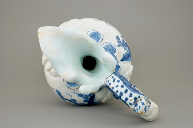 A large French faience blue and white relief-decorated jug, 18th C.