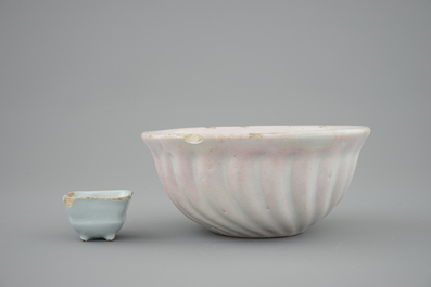 A white Dutch Delft baking mold and a miniature cup, 18th C.