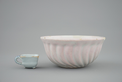 A white Dutch Delft baking mold and a miniature cup, 18th C.