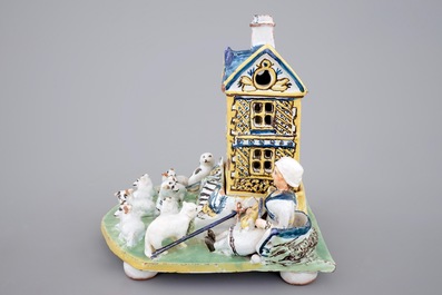 A rare French pottery group with musicians herding sheep by a house, 18th C.