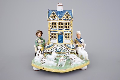 A rare French pottery group with musicians herding sheep by a house, 18th C.