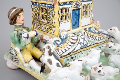 A rare French pottery group with musicians herding sheep by a house, 18th C.