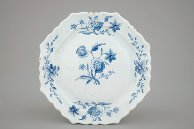 A large Dutch Delft blue and white vase and cover, a plate and a cream jug, 18th C.