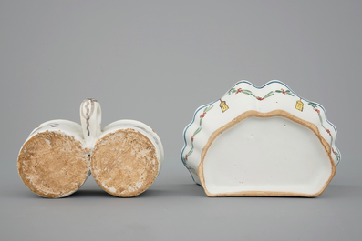 A Dutch Delft strainer, a wall flower holder and a cruet stand in French faience, 18th C.