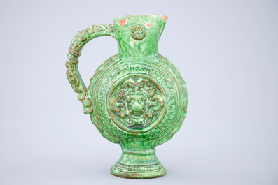 A green glazed Saintonge relief decorated jug, France, 17th C.