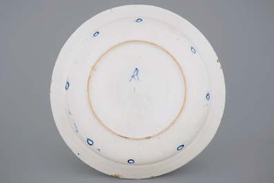 An exceptionally large Dutch Delft blue and white floral dish, 18th C.