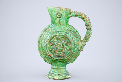 A green glazed Saintonge relief decorated jug, France, 17th C.