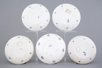 A set of five polychrome Dutch Delft plates with flower baskets, 18th C.