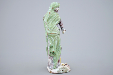 A tall standing figure of a saint, polychrome Dutch Delftware, 18th C.