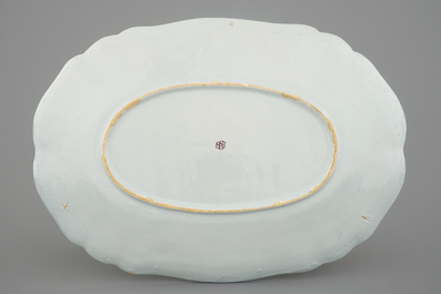A large oval manganese Dutch Delft floral dish, 18th C.