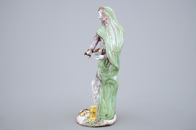 A tall standing figure of a saint, polychrome Dutch Delftware, 18th C.