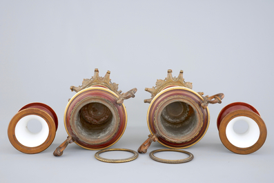 A pair of S&egrave;vres style vases with bronze mounts, Brussels, 19th C.
