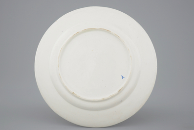 A Tournai porcelain plate with Saint-Georges fighting the dragon, 18th C.