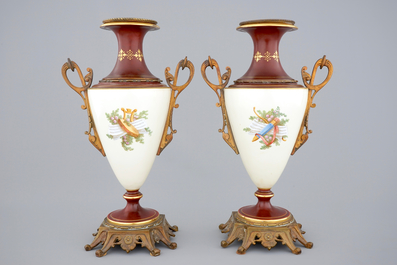 A pair of S&egrave;vres style vases with bronze mounts, Brussels, 19th C.
