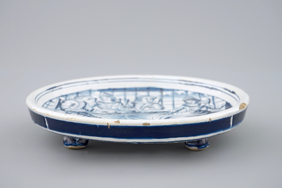 A dated blue and white salver with a tea drinking scene, Harlingen, Friesland, 1775