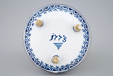 A dated blue and white salver with a tea drinking scene, Harlingen, Friesland, 1775