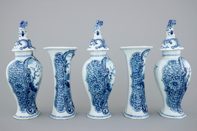 A 5-piece blue and white Dutch Delft garniture with landscape design, 18th C.