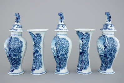 A 5-piece blue and white Dutch Delft garniture with landscape design, 18th C.