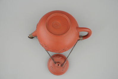 A Dutch Delft Ary de Milde red earthenware teapot and cover, late 17th C.