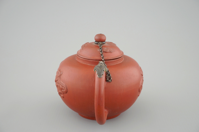 A Dutch Delft Ary de Milde red earthenware teapot and cover, late 17th C.