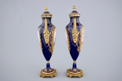 A pair of bronze-mounted signed and marked S&egrave;vres porcelain vases, 19th C.