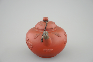 A Dutch Delft Ary de Milde red earthenware teapot and cover, late 17th C.